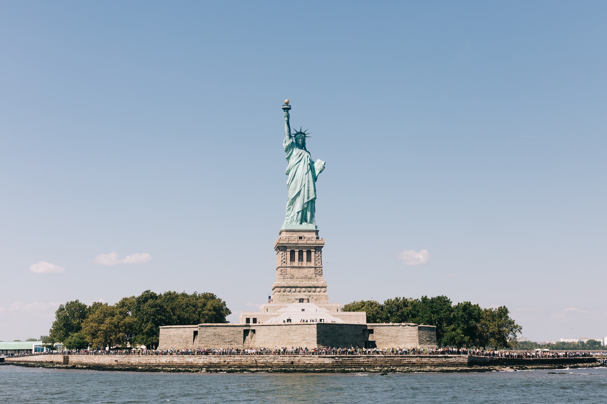 what's the name of the island the statue of liberty's on